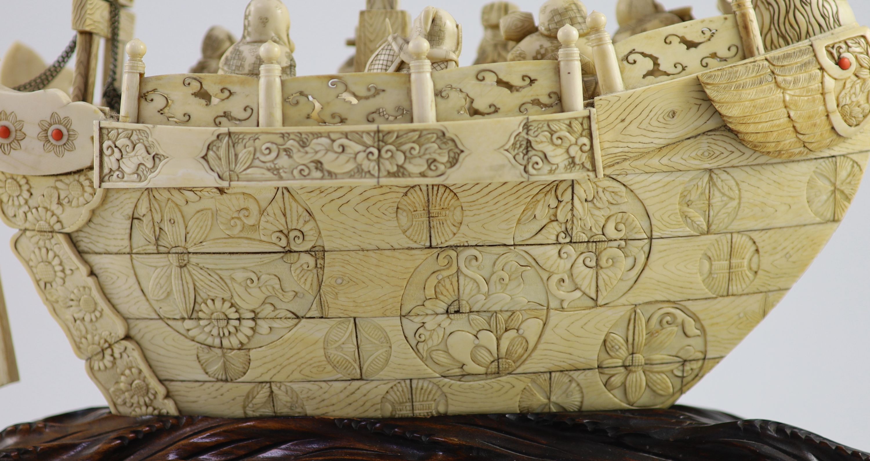 A large Japanese ivory okimono of the seven Gods of Happiness treasure ship the Takarabune, early Showa period, Total height 42 cm, length 41 cm, slight faults